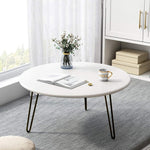 White table with black iron stands