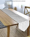 white & black checker table runner with tussle