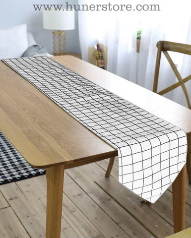 white & black checker table runner with tussle