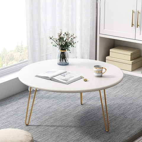 White table with golden iron stands